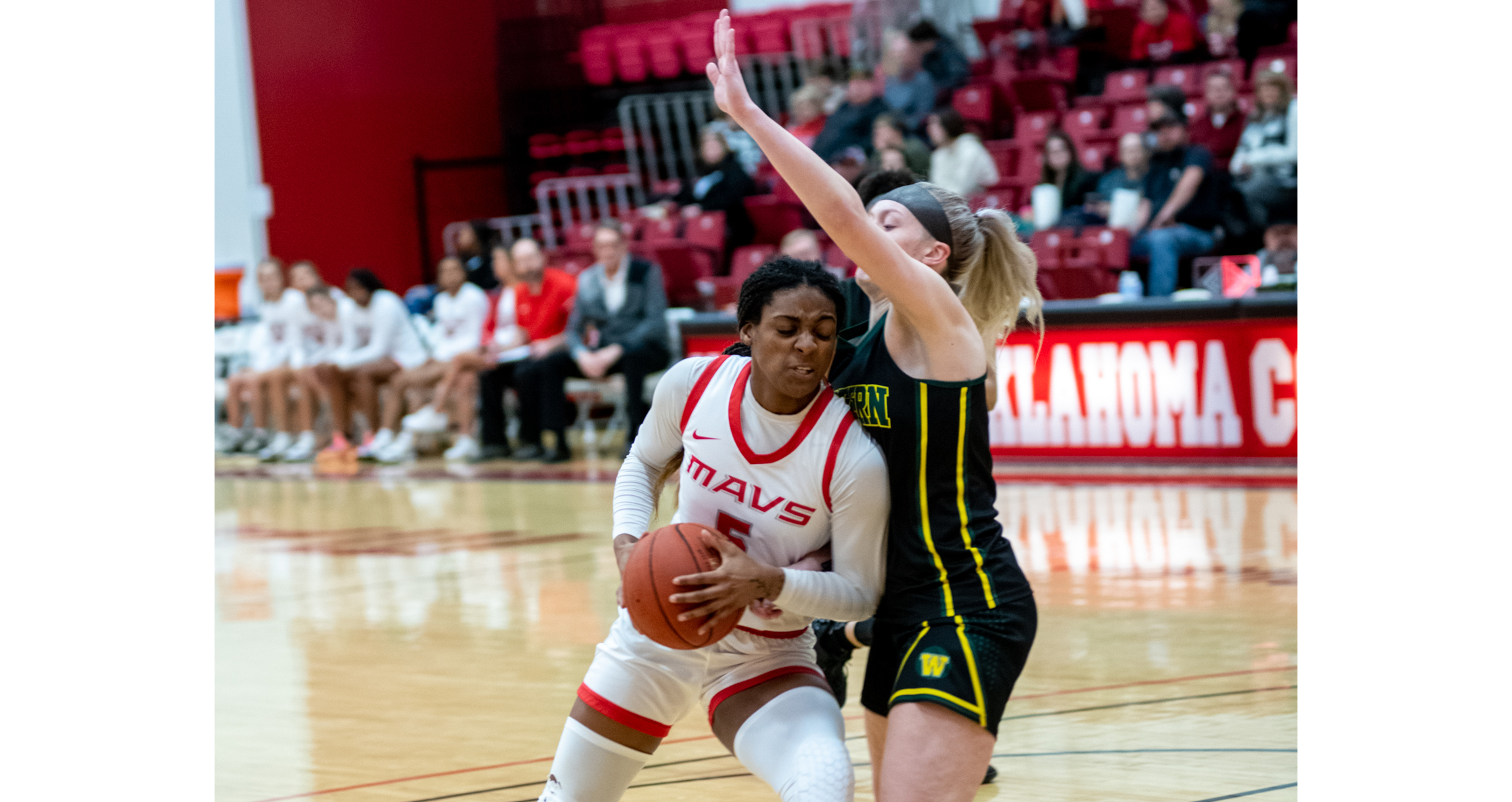 Lady Mavs drop home game to Belles